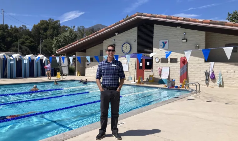 Ryan Power standing in front of the Montecito YMCA Pool