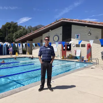 Ryan Power standing in front of the Montecito YMCA Pool